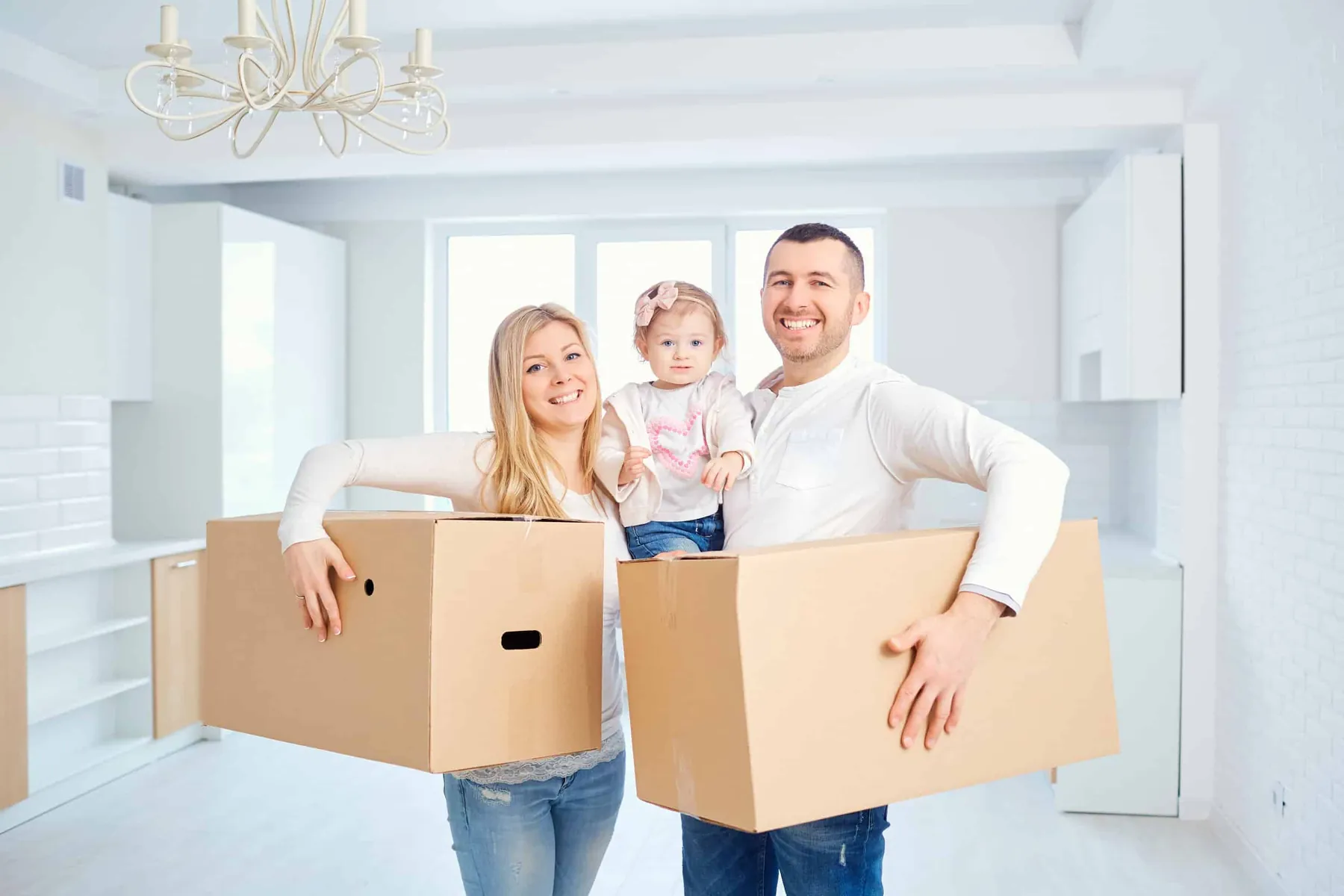 Airdrie real estate agents: happy family moving into their new Airdrie home