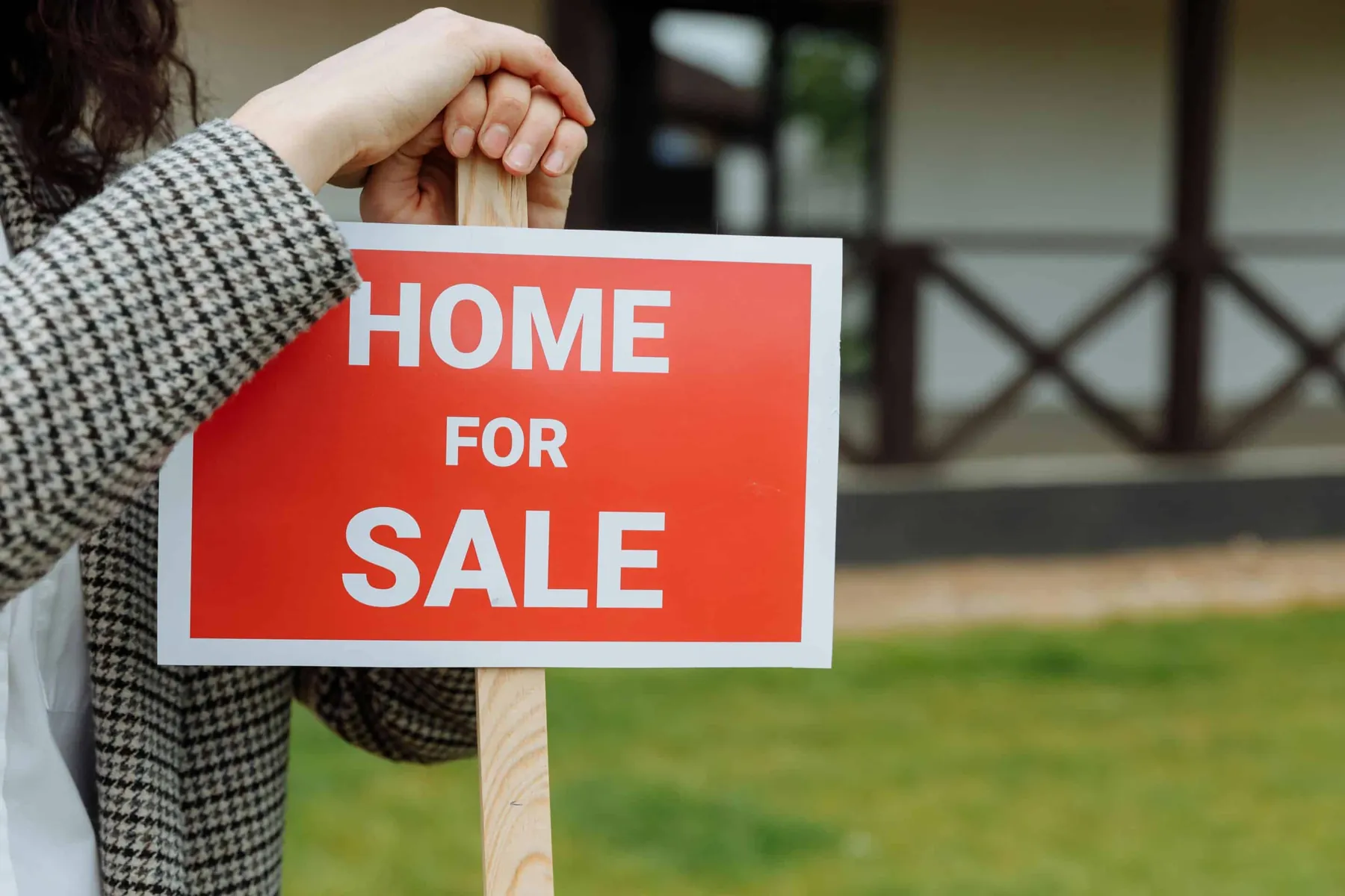 Airdrie real estate agent home for sale sign